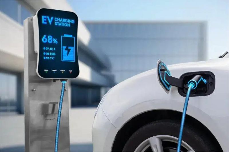 stasiun pengisian cepat baterai mobil listrik modern dengan layar digital dan kabel pengisian