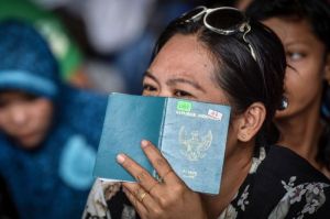 Ilustrasi pekerja migran Indonesia (PMI).((SHUTTERSTOCK/HAFIZ JOHARI))
