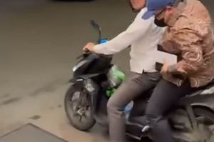 Momen Fahri Hamzah gunakan jasa ojol untuk menembus macet Jalan Jenderal Sudirman pada Rabu (28/5/2025) malam.(Hanifah Salsabila)