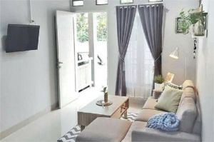 ruang tamu minimalis dengan dekorasi simpel dan rapi