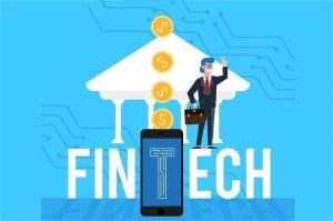 tim startup fintech dengan laptop dan grafik pertumbuhan pendanaan di layar